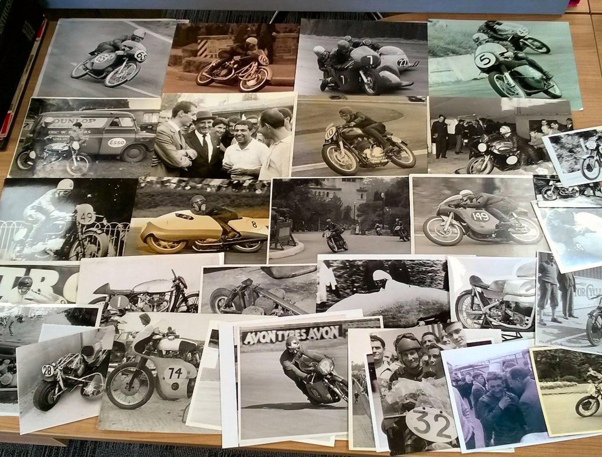 A good quantity of racing photographs of the open face helmet era, original and copy images, much