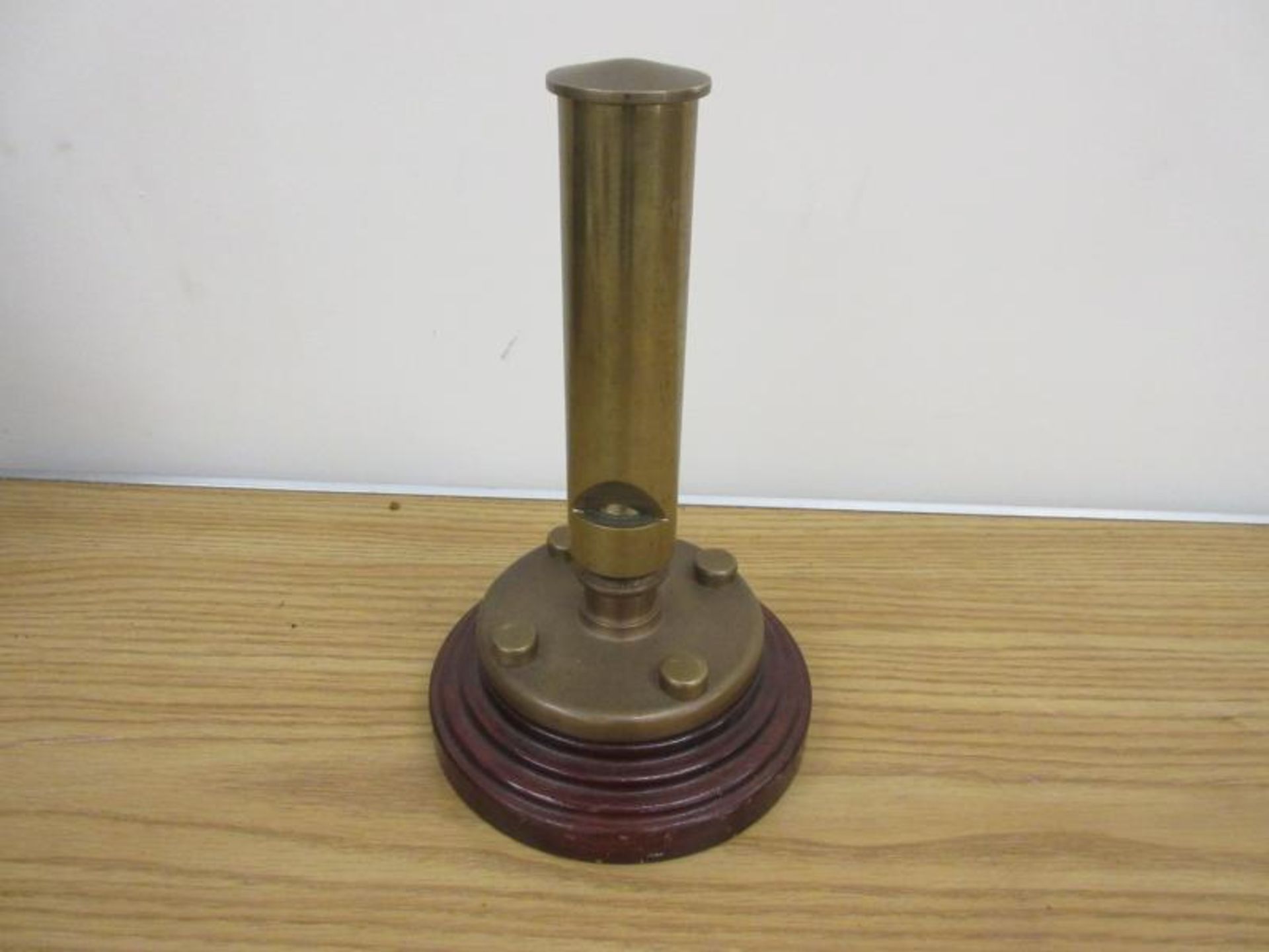 Steam brass whistle mounted on a plinth