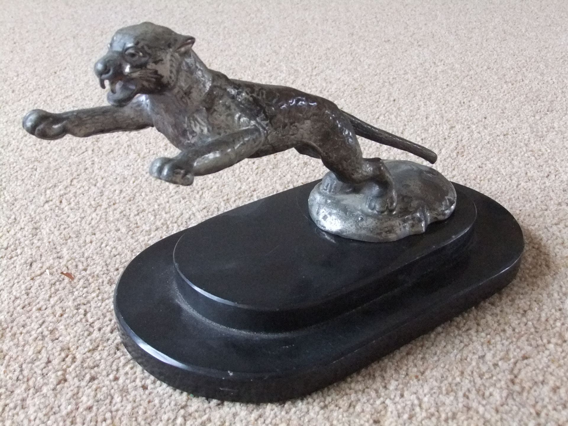 Early leaping Jaguar mascot inscribed copyright Desmo