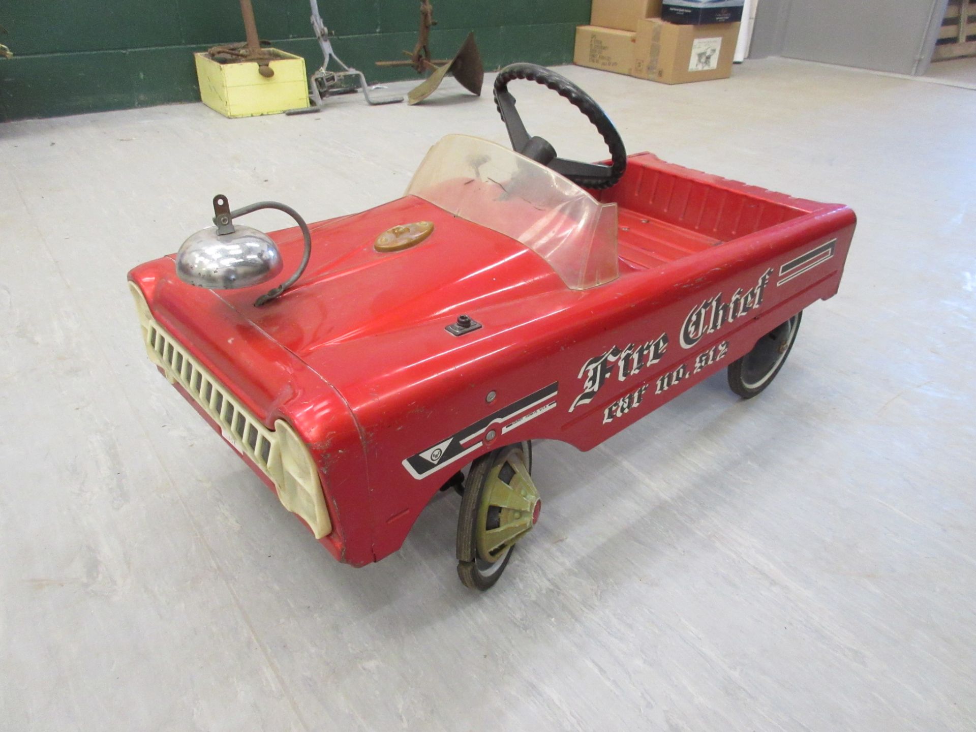 Child's metal pedal car sign written Fire Chief