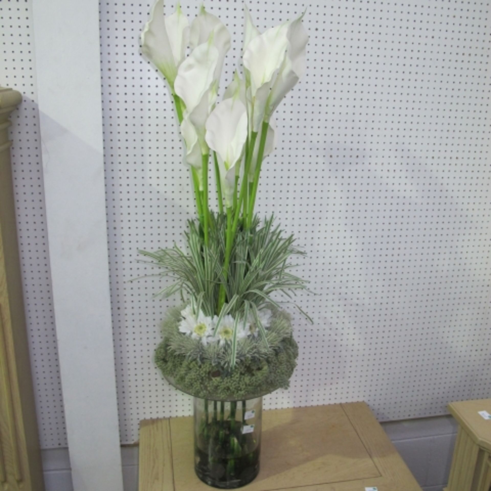 Four artificial Flower displays of various forms and designs (one features  3 new pillar candles)