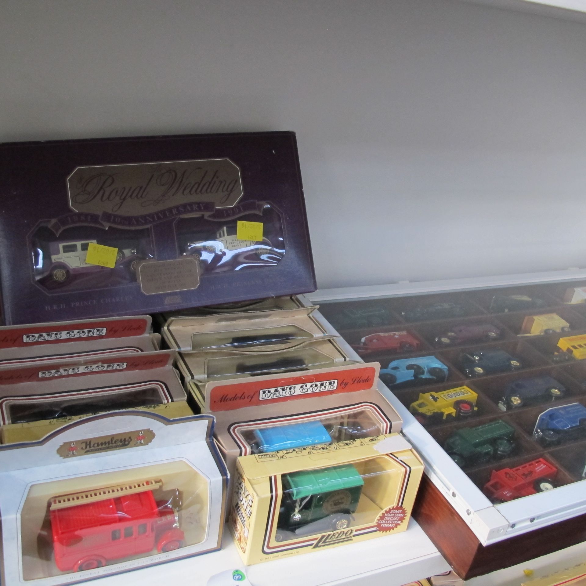 Over seventy die cast model cars, thirty of which are displayed in bespoke case, the remainder are