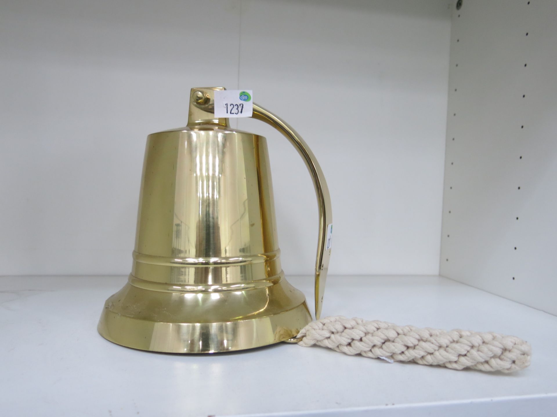 * Wall hanging brass bell base. Diameter 17cm, height 19cm. New (est £40-£60)