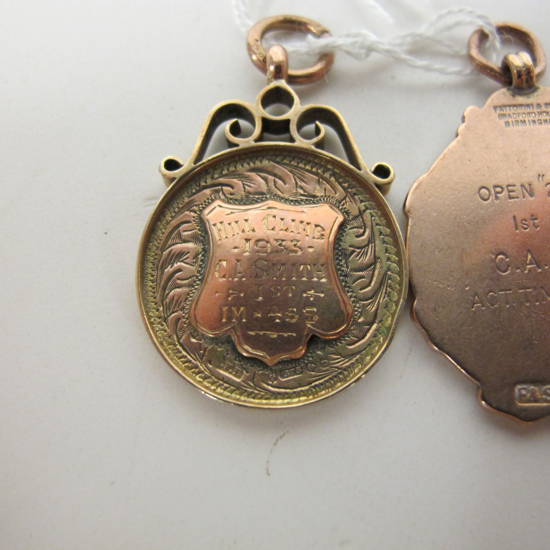 Two 9ct gold fobs (both inscribed), 20gms (est £50-£70) - Image 2 of 2