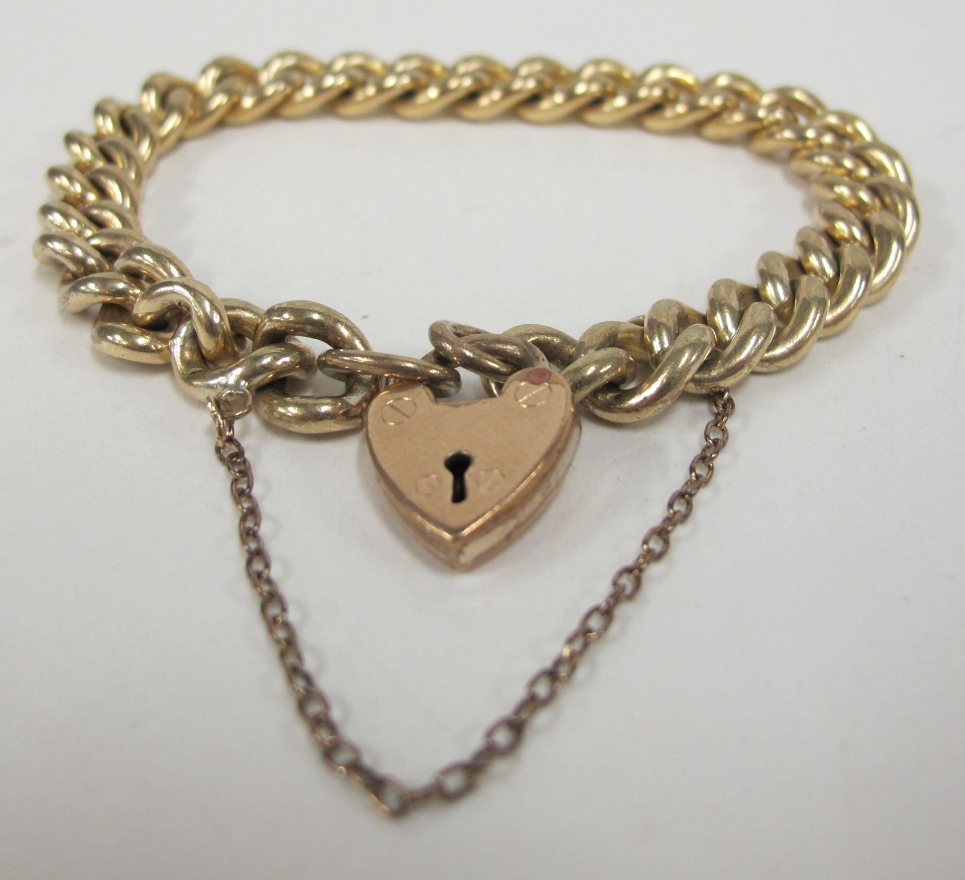 Antique 'Gold Shell' Curb Bracelet with Heart Padlock (est £20-£40)