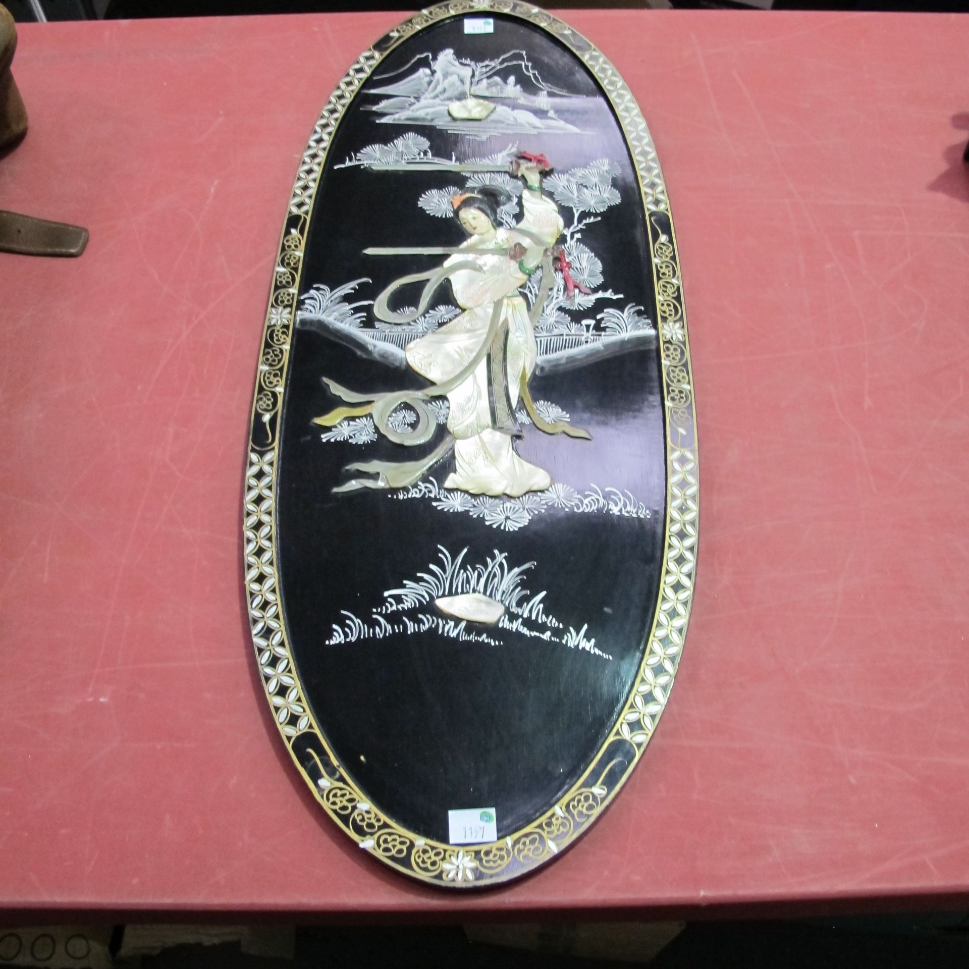 A Chinese Mother of Pearl Plaque with central lady holding two swords (H91cm, W35.5cm, D2cm) (est £