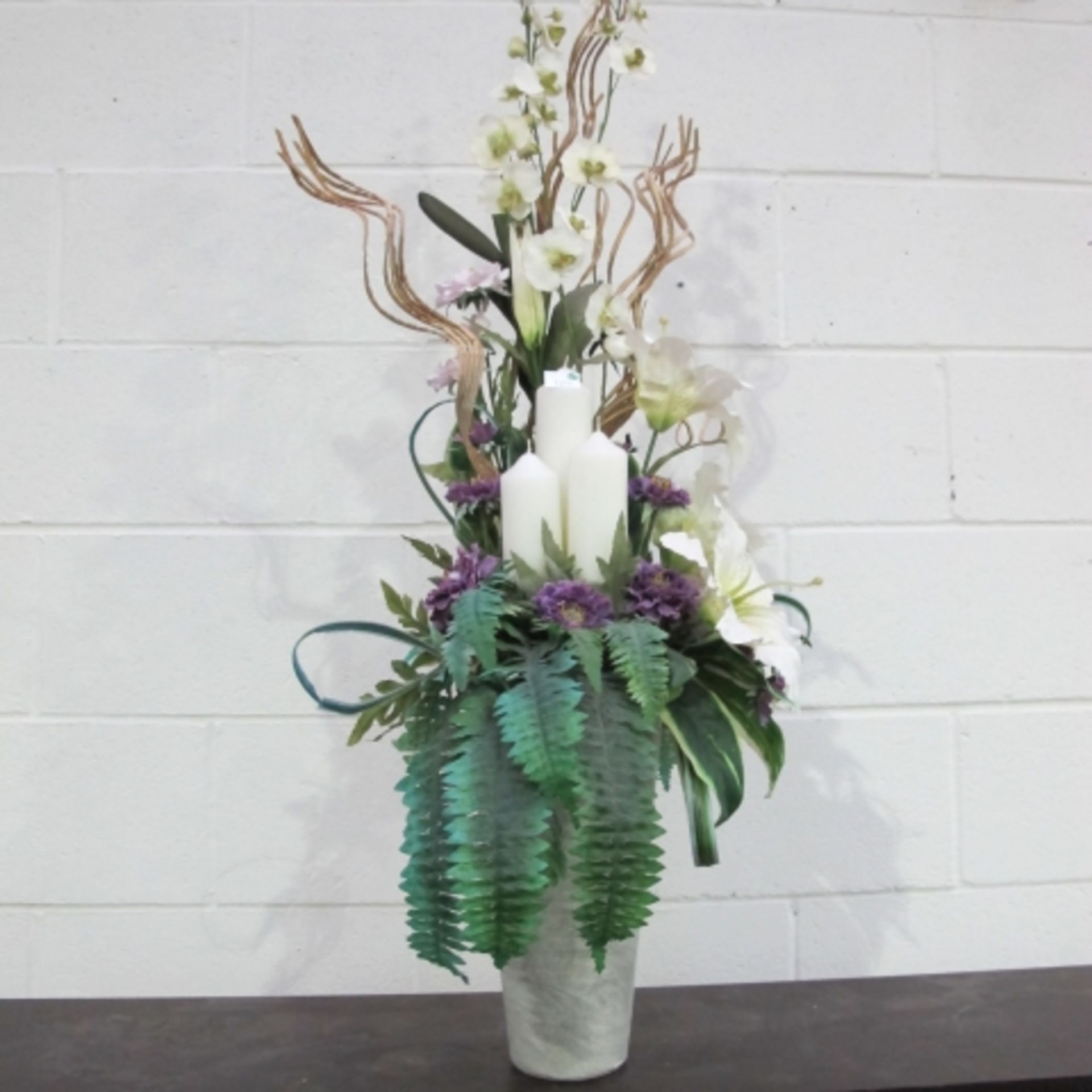 Four artificial Flower displays of various forms and designs (one features  3 new pillar candles) - Image 3 of 4