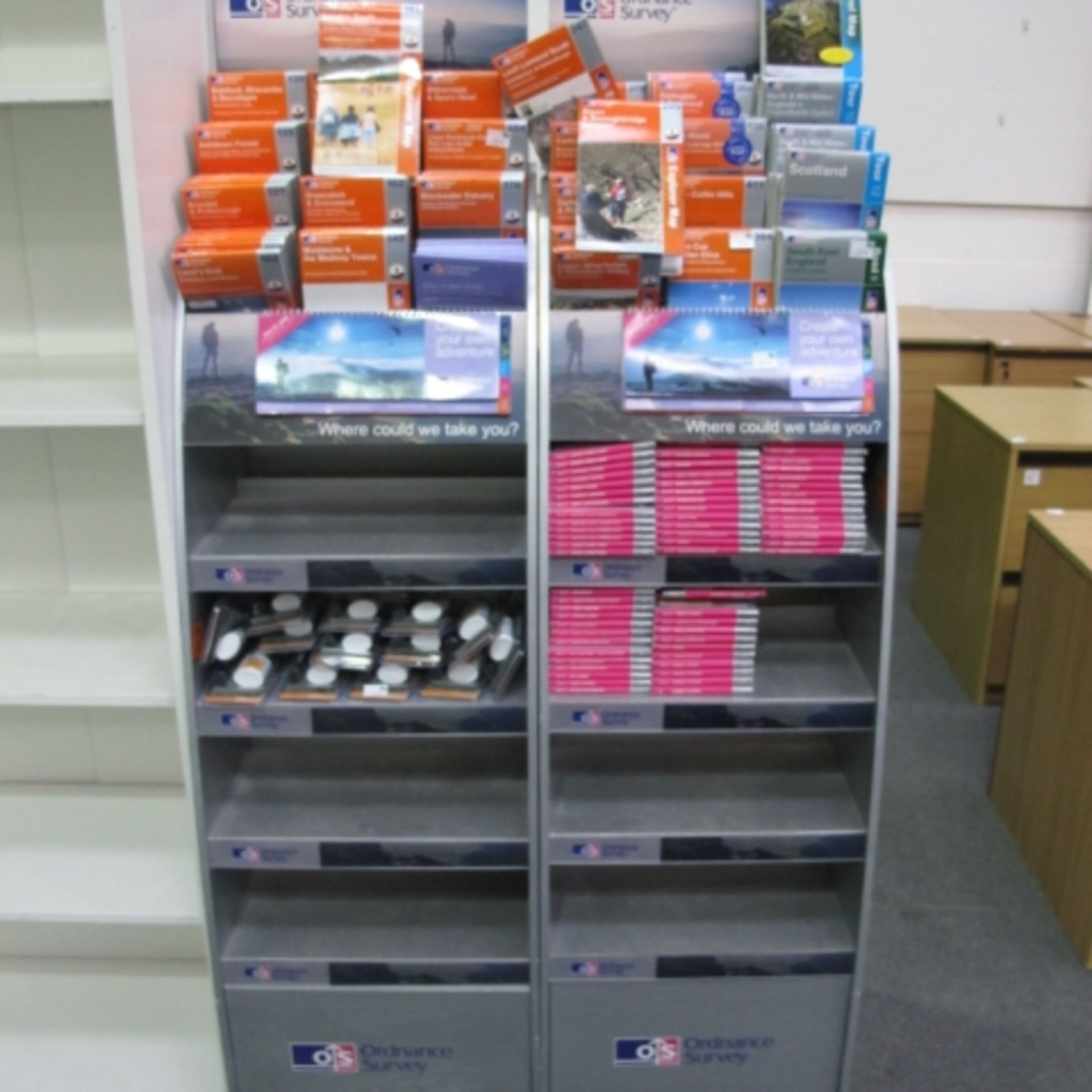 2 x Bespoke Display stands with a lower integral shelf for Ordnance Survey Maps, on castor wheels.