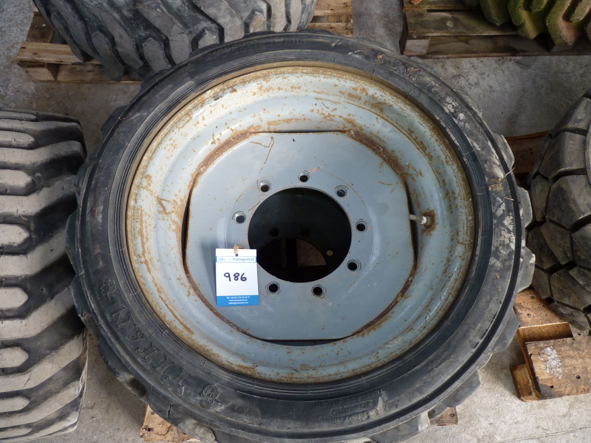 * Pair of Foam Filled OTR Tyres and Rims. 305-546, 9-stud, rim centre diameter 200mm. One 10-16.5,