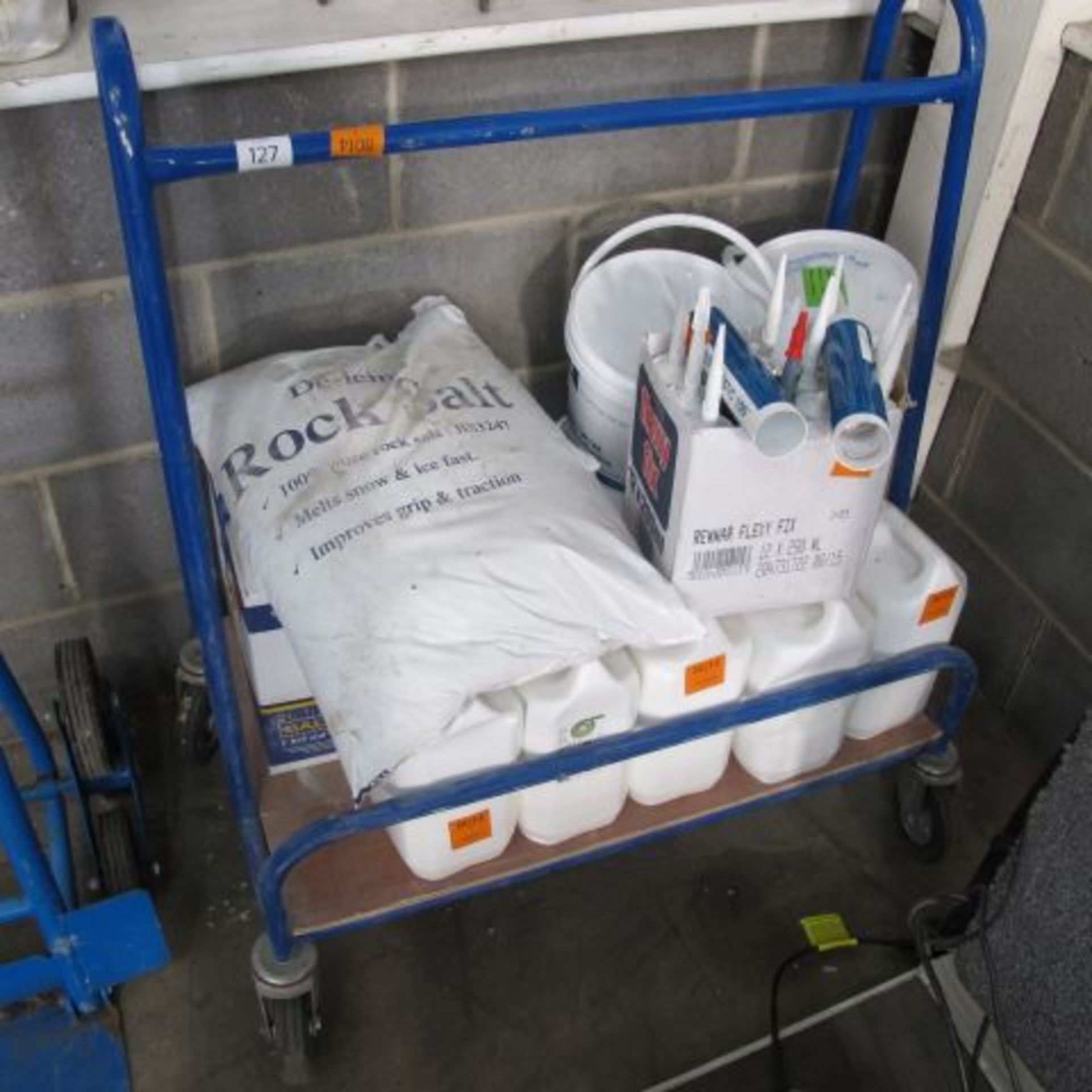 * A Porters Trolley c/w contents to include silicone, rock salt, Stop Gap, Autofix Adhesive etc