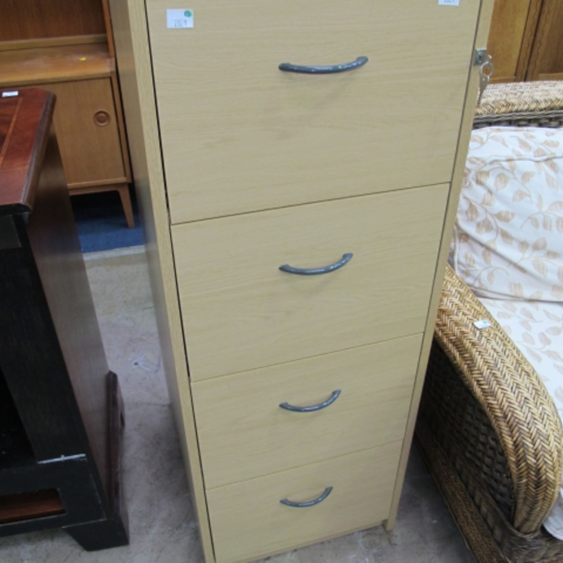 A tall Office Filing Cabinet with four lockable drawers ( H 132cm x W 48cm x D 60cm) with keys (est