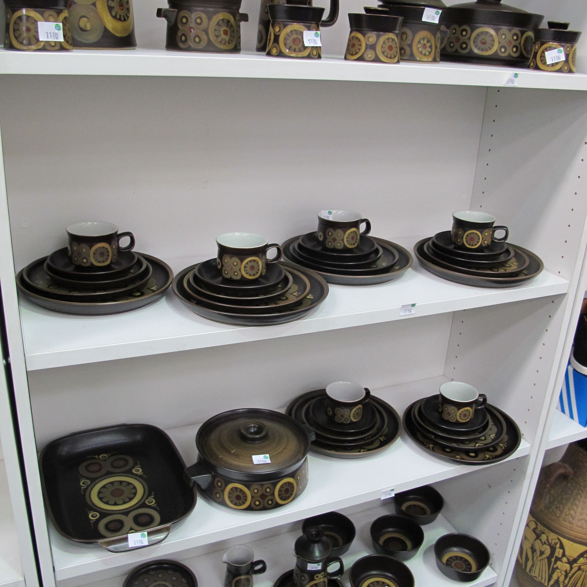 A lot to include 53 pieces of Denby Arabesque Ceramics. Items include salt and sugar pots, 2 x