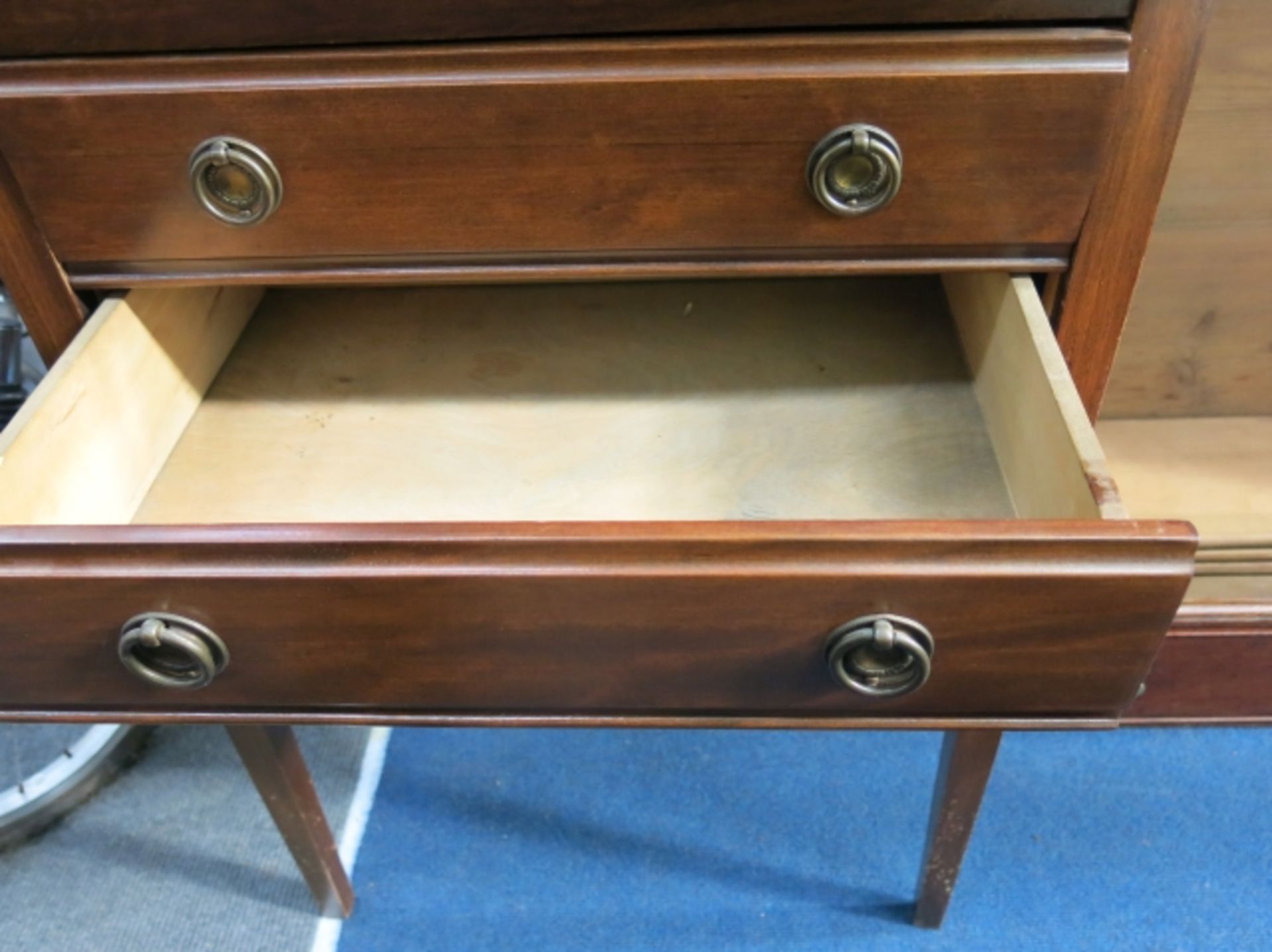 A mahogany three drawer unit with metal circular handles, the top and bottom drawers have drop - Image 3 of 4