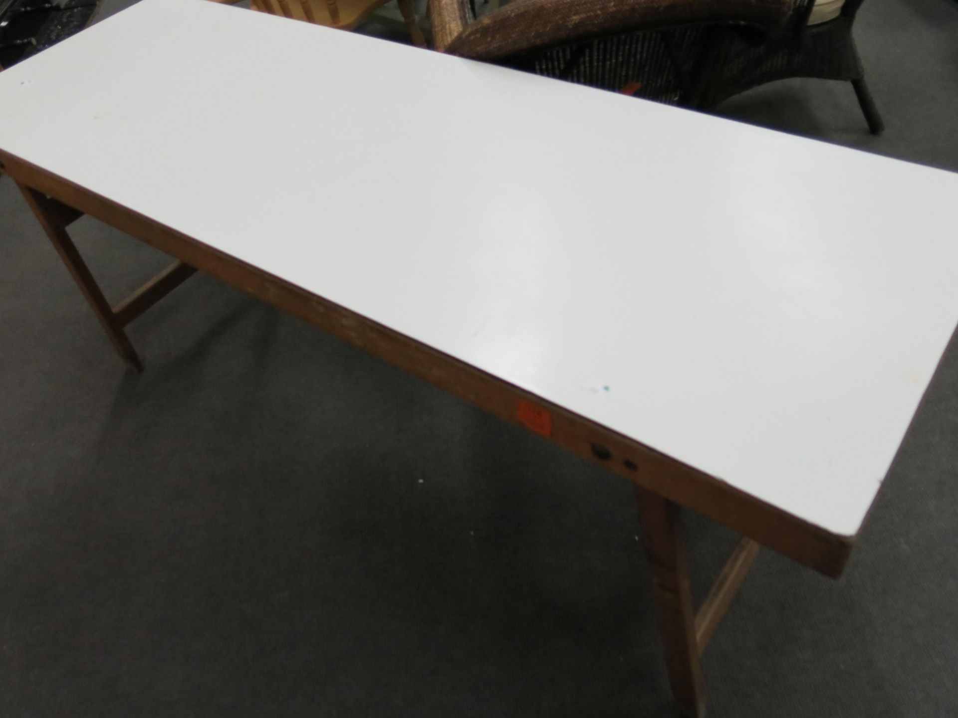 A Formica topped folding table (wooden frame) (183cm x 60cm) (est £20-£40)