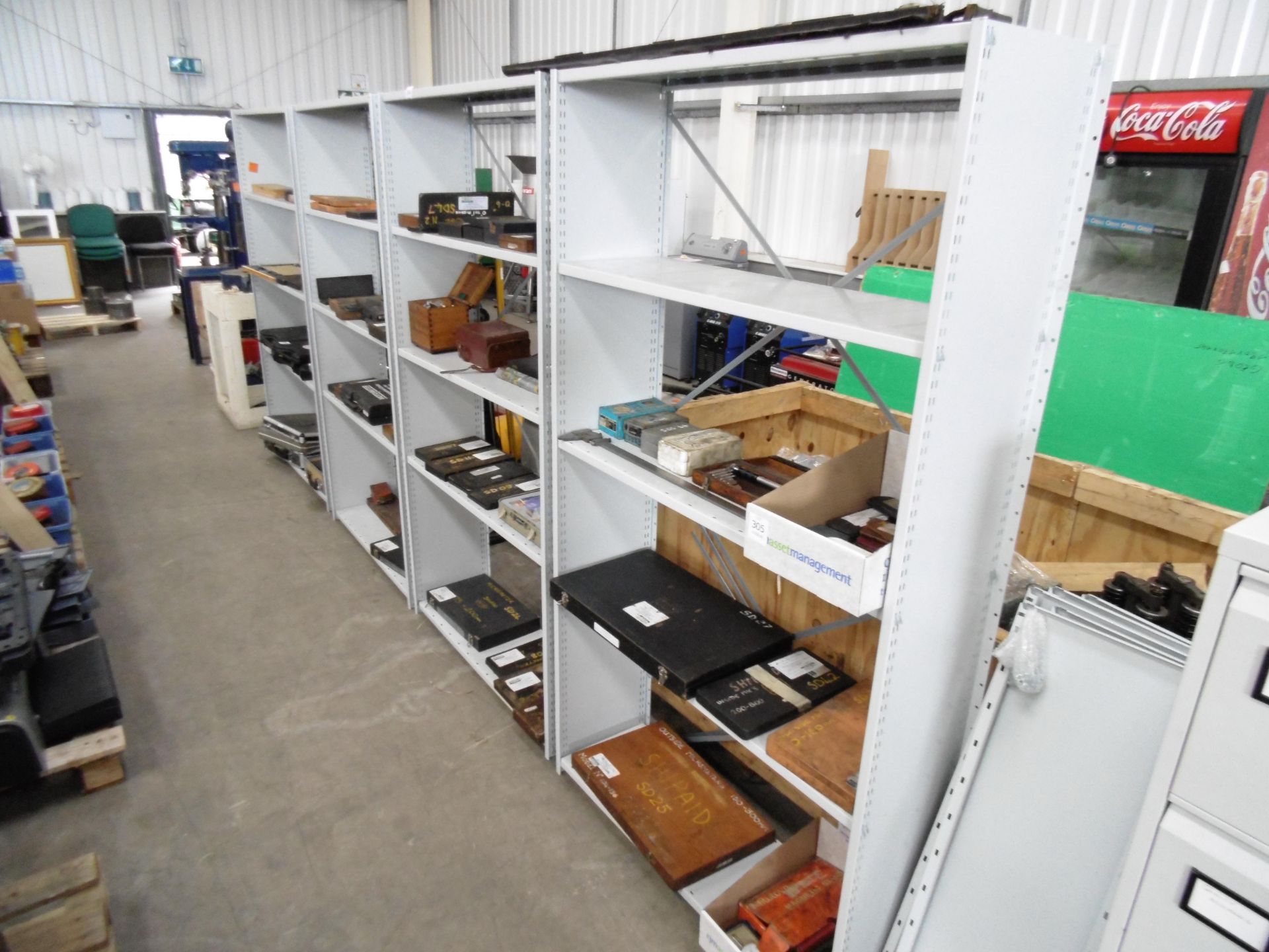 * 4 x Metal shelving units c/w extra shelves (items on shelves not included)