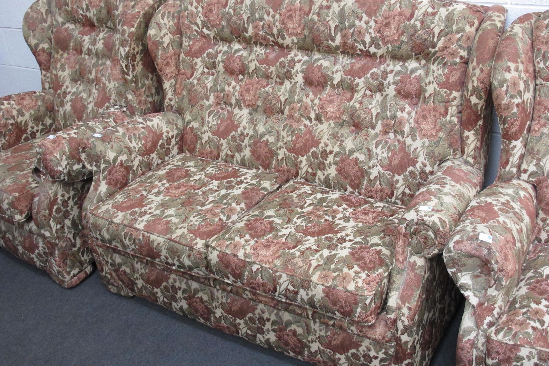 A fabric covered three piece suite - a two seat settee & two wing back armchairs all with floral - Image 3 of 5