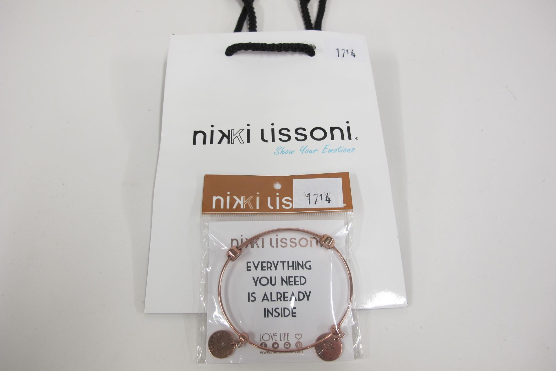 * Nikki Lissoni Jewellery. Rose plated bangle with 2 x fixed charms 'Inner Strength' & 'Made With