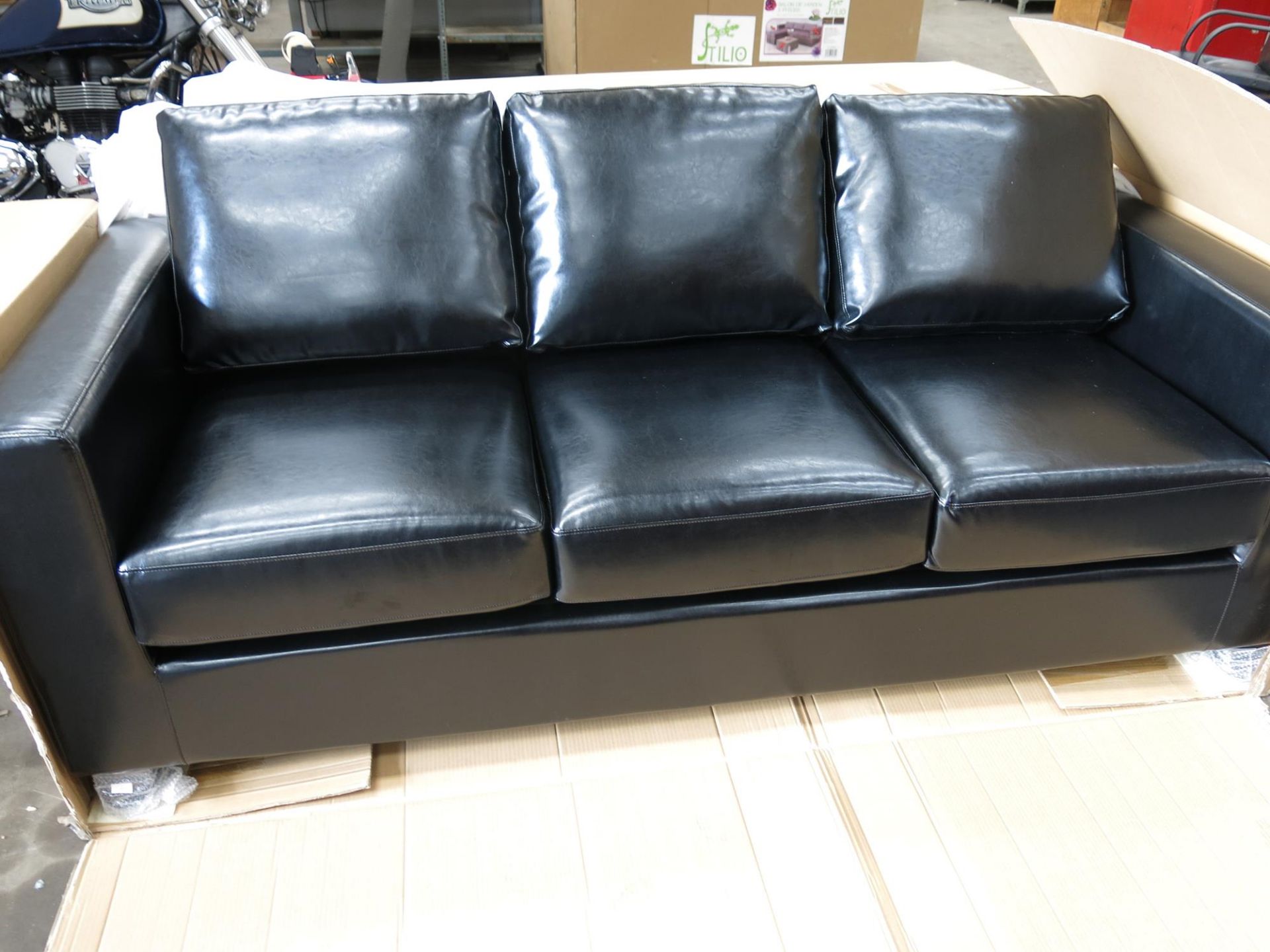 * A new/boxed three seater Aintree Sofa with dark wenge legs. The faux PU leather upholstery is