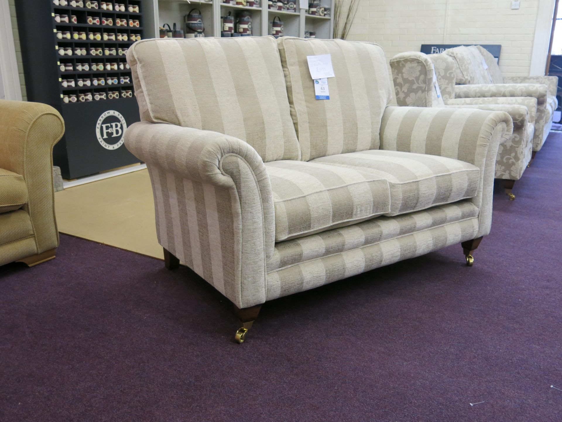 Alstons Ixworth two seat sofa with oyster stripe cover with polished brass castors on front feet. - Image 2 of 4