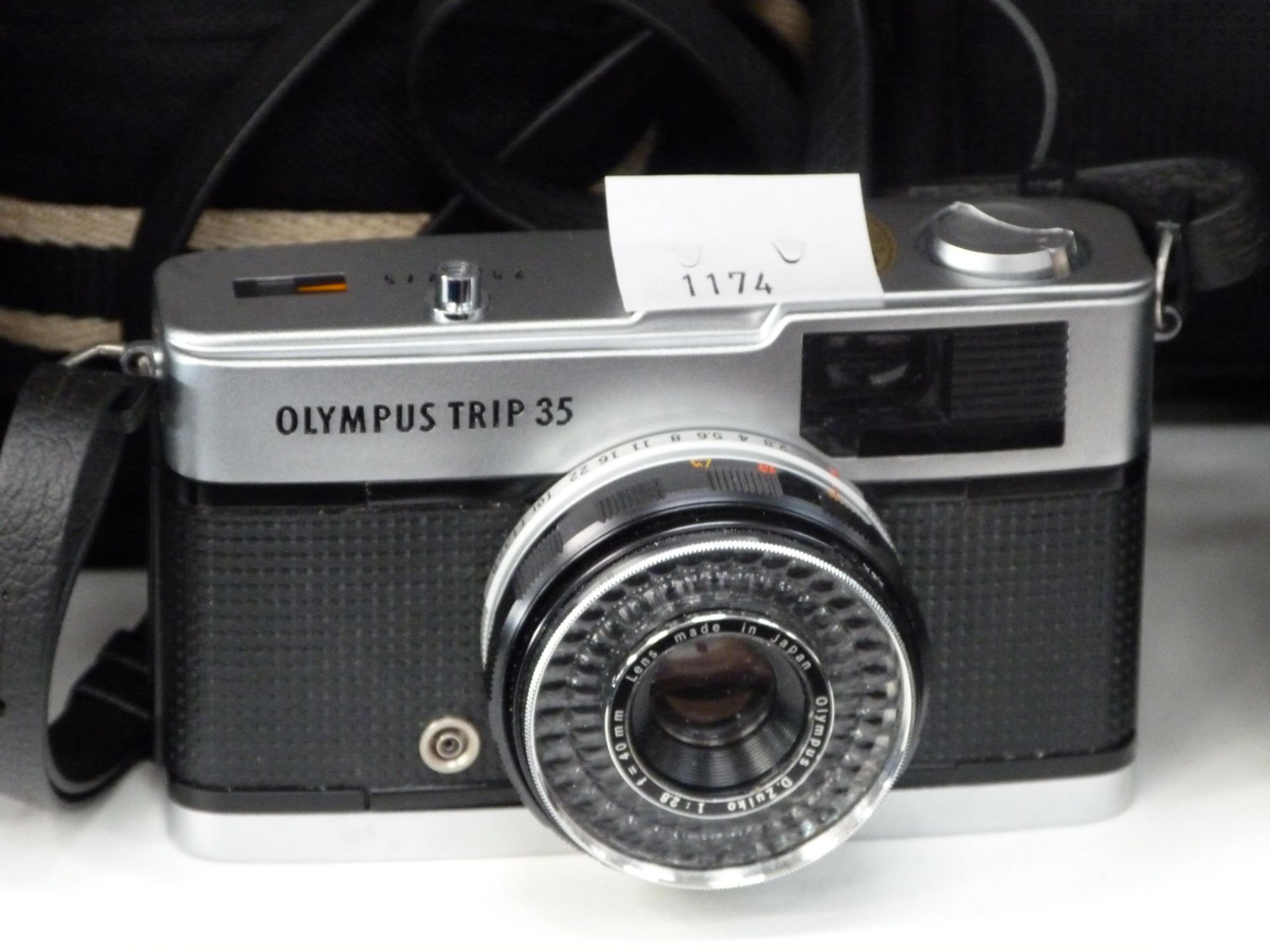 An Olympus Trip 35 camera, with case (est £40-£50)