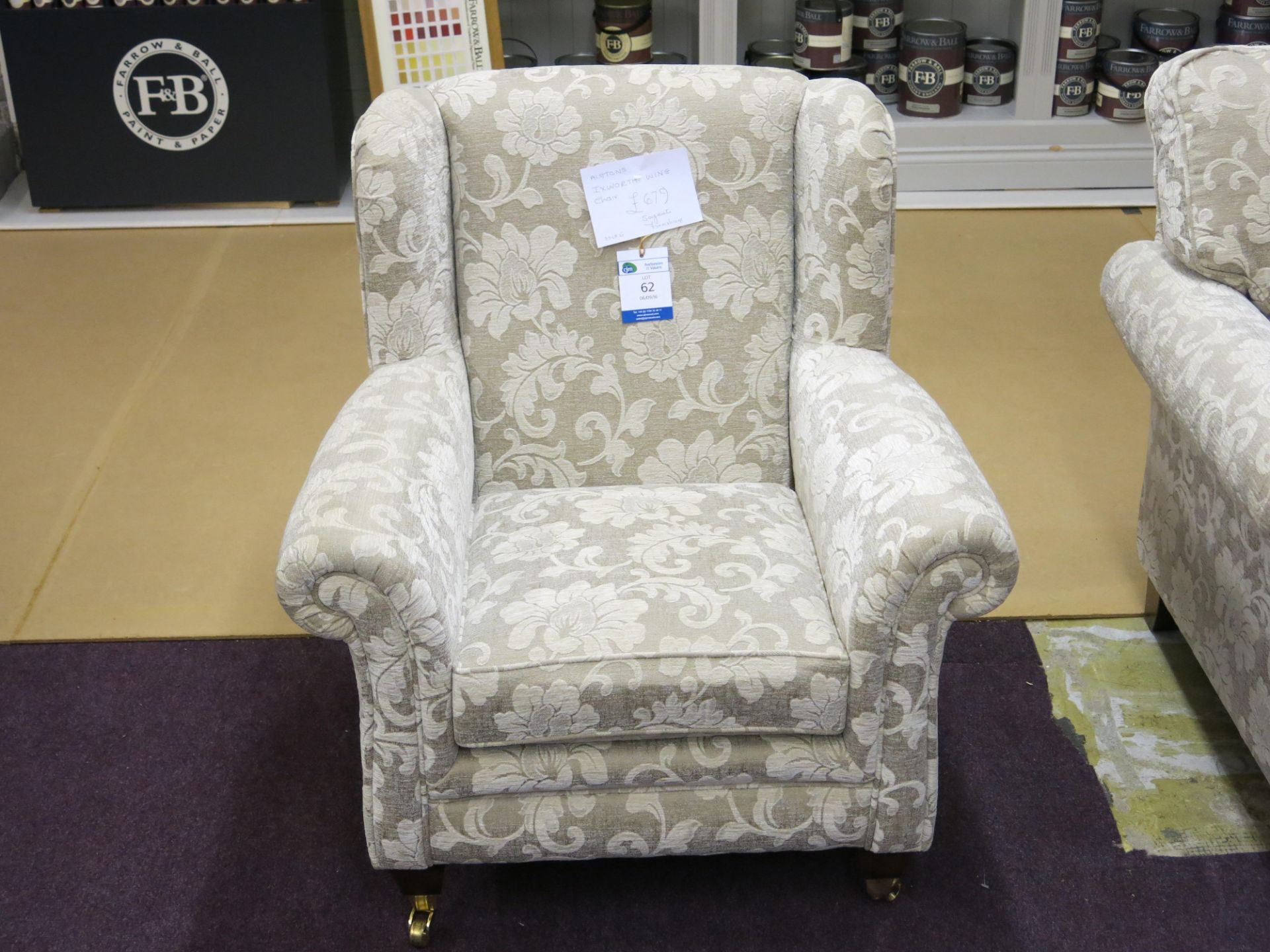 Alstons Ixworth wing back chair with polished brass castors on front feet. RRP £679