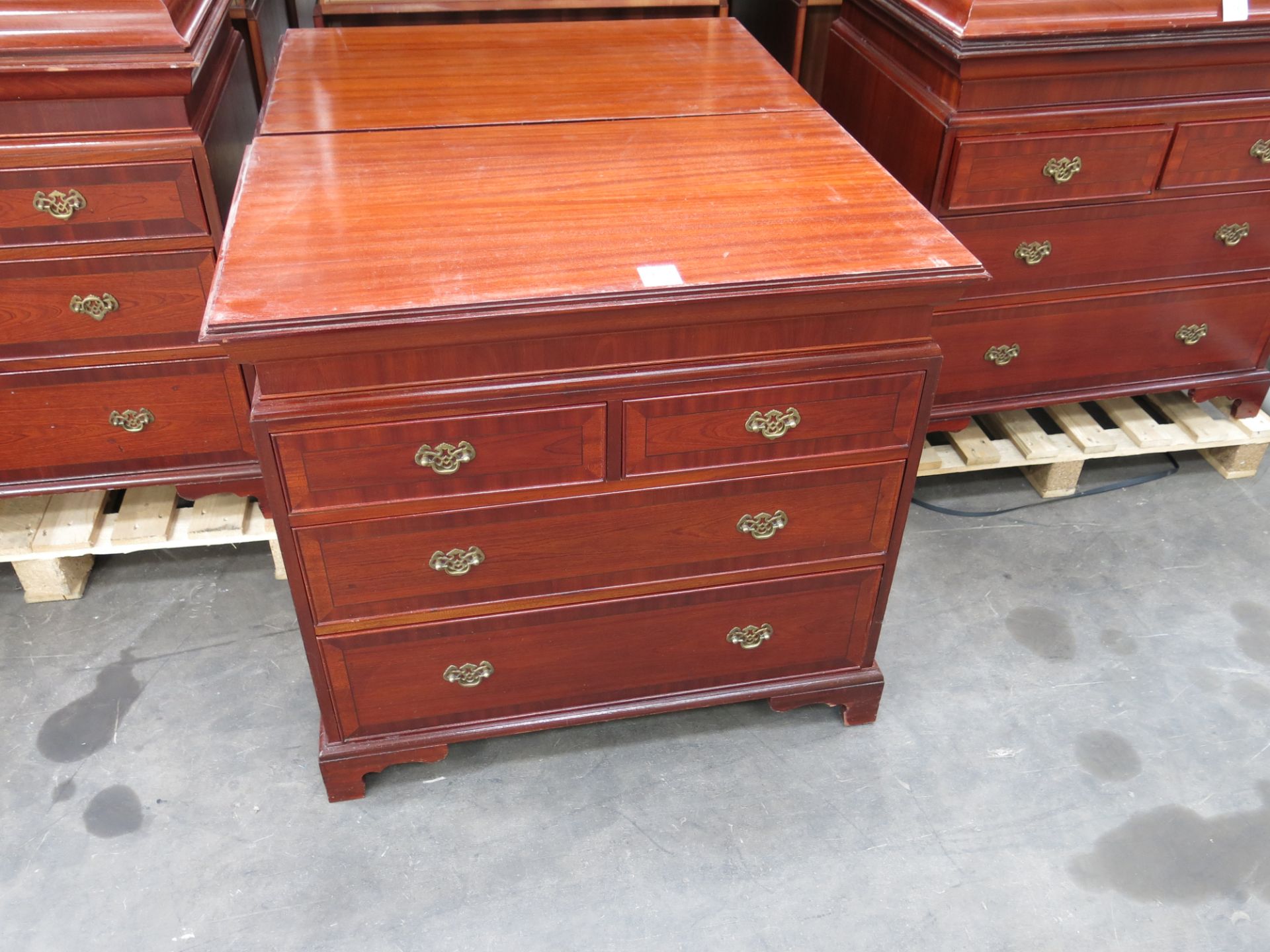 * 2 x Mahogany effect 4 drawer chest of drawers with brass drop handles. Please note there is a £