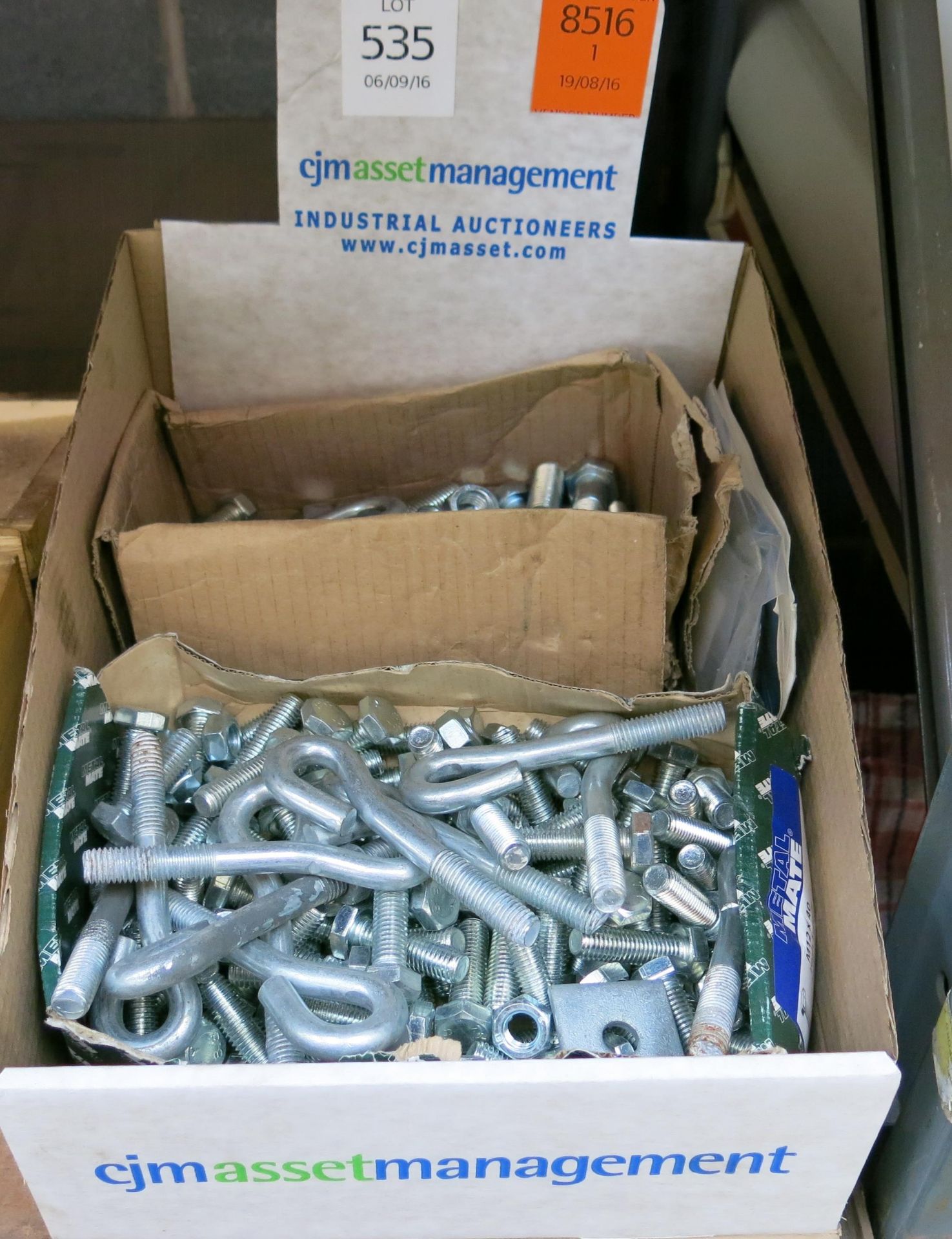 A box of anchor bolts etc