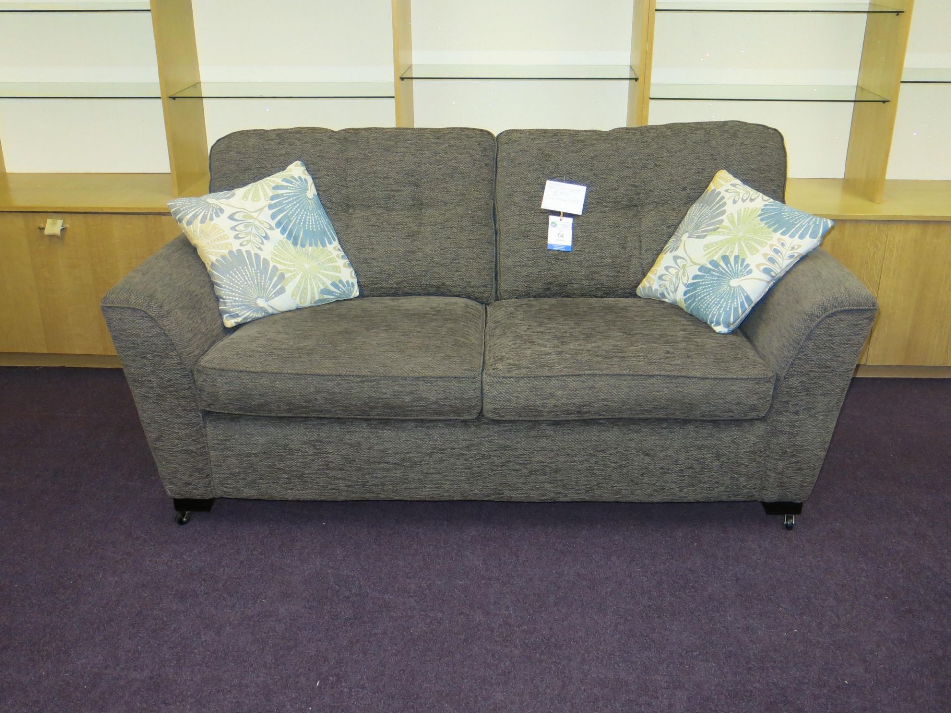 Alstons Vigaro three seat sofa together with two floral scatter cushions. The sofa cover is