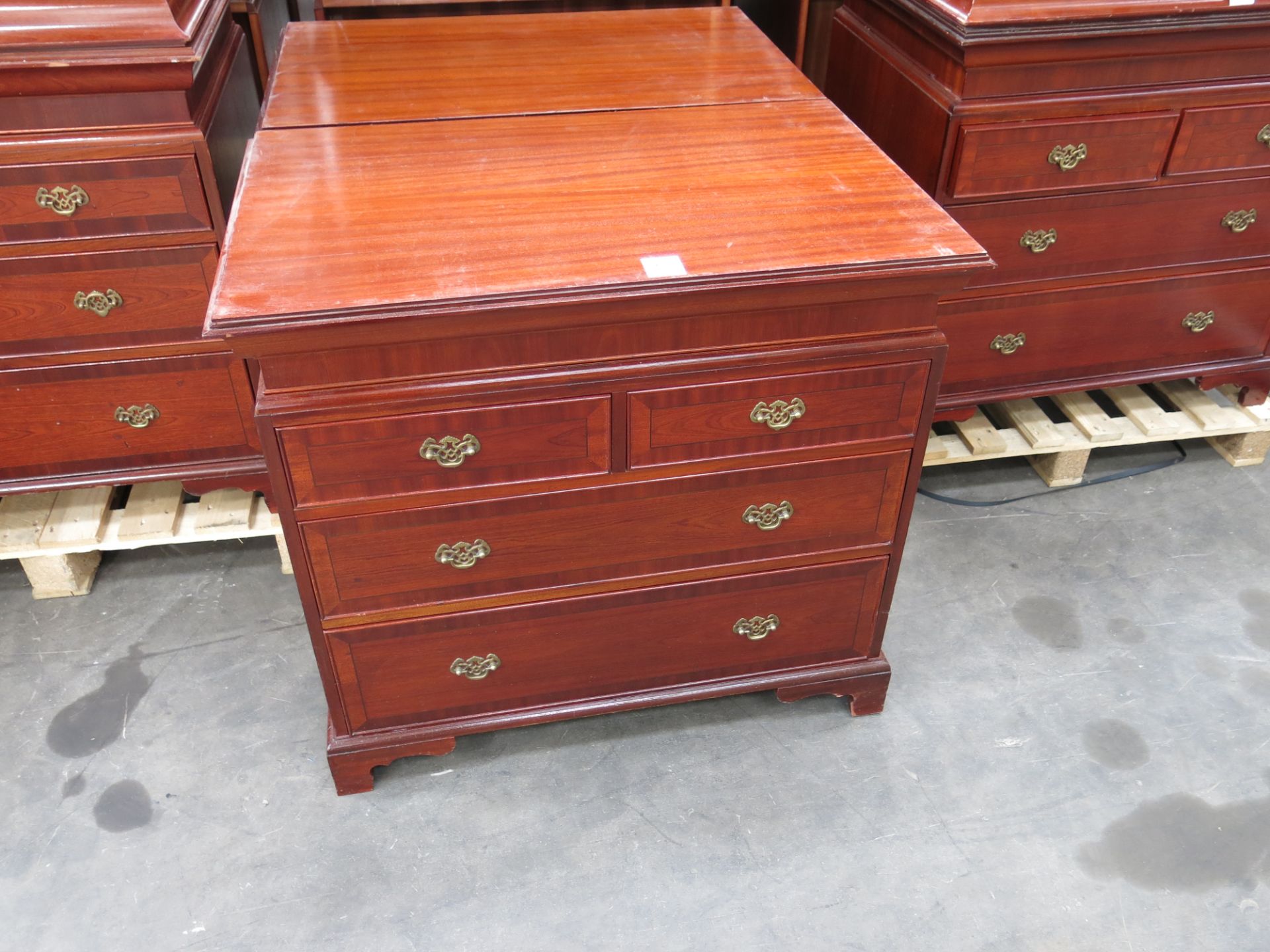 * 2 x Mahogany effect 4 drawer chest of drawers with brass drop handles. Please note there is a £