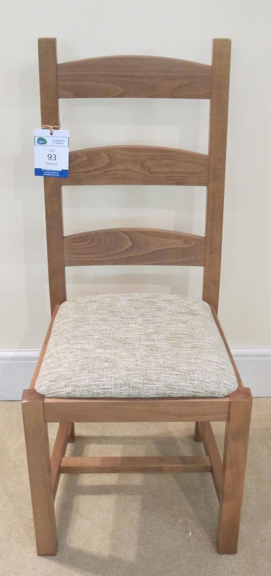 Eaves ladder back chair with olive seat pad.