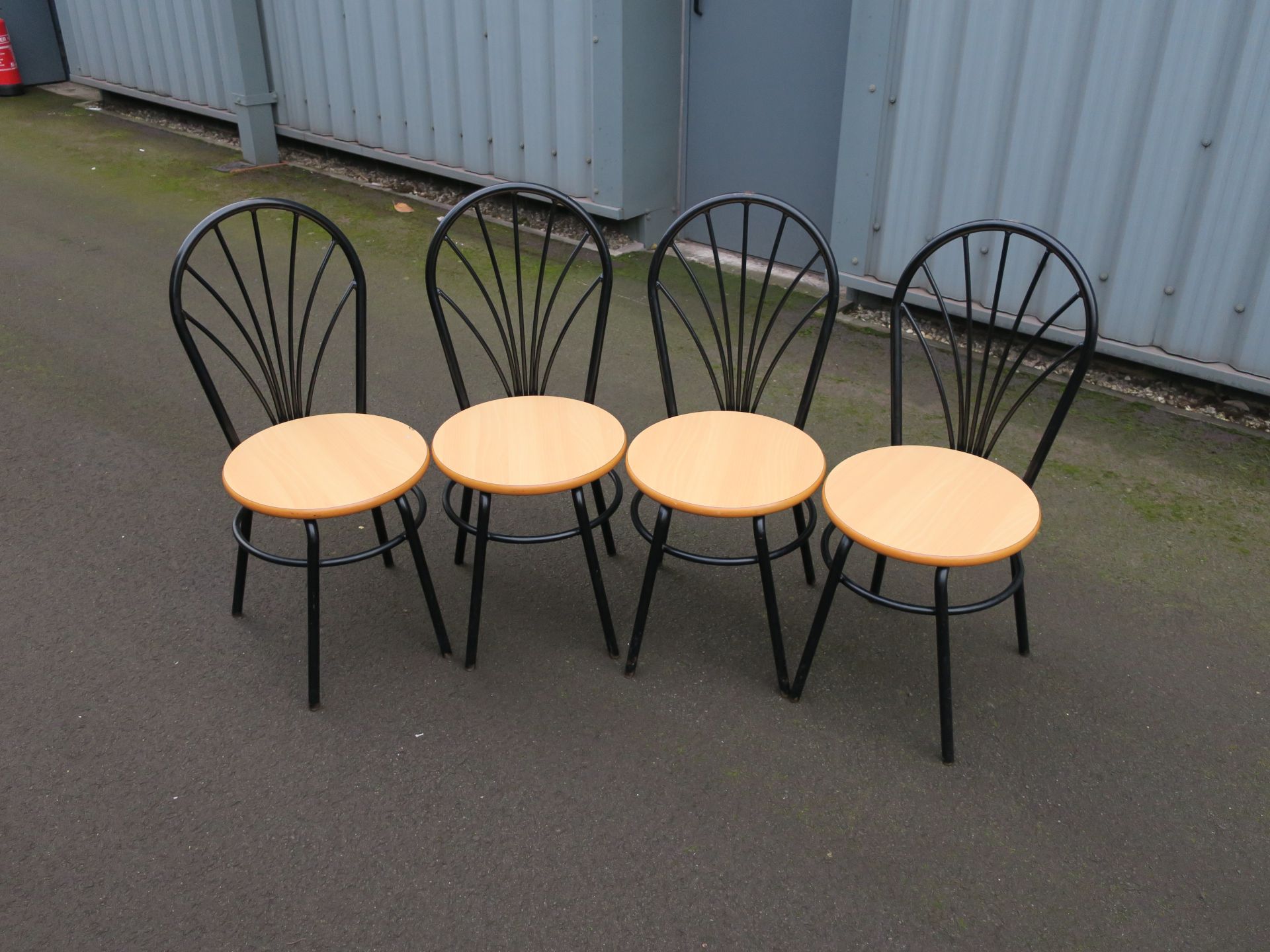 * 4 x Black metal framed chairs with wooden seats. Picture for illustration purposes only.