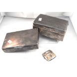 A silver table cigarette box, another similar and a silver vesta (3)