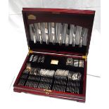 A mahogany canteen of 68 pieces of silver plate cutlery including servers.