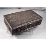 An Indian sterling silver table cigarette box decorated with figures and animals 17cm x 10cm