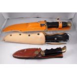 A Rostfrei "Crocodile Hunter" Sheath knife 34cm long, a Pallux original Bowie sheath knife 31cm long
