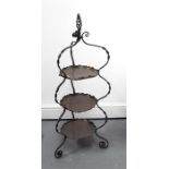 A three tier copper and wrought iron cake stand 37cm wide