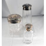 An Edwardian silver topped cut glass dressing table jar Chester 1905, a silver topped sugar caster