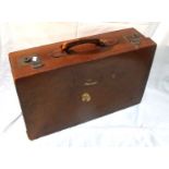A vintage leather suitcase 56cm wide