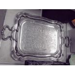 A Silver plated two handled tray decorated engraved flowers 73cm x 46cm and another similar (2)