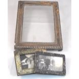 A silver photo frame 13cm x 18cm and two other smaller silver photo frames (4)