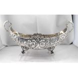 A Continental silver two handled bowl decorated in relief with flowers 27cm wide 284g