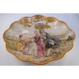 A continental oval dish decorated figures painted by Lessore, label to underside "Bought at the