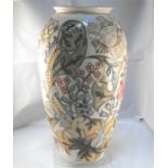 A Moorcroft pottery vase, decorated flowers on a pale yellow ground 31cm high Condition Report The