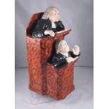 A 19thC Staffordshire group, the Vicar and Moses, after Ralph wood 23cm high