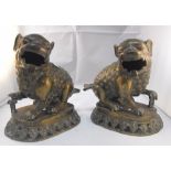A pair of Chinese Kylin's with inset ruby eyes 18cm high