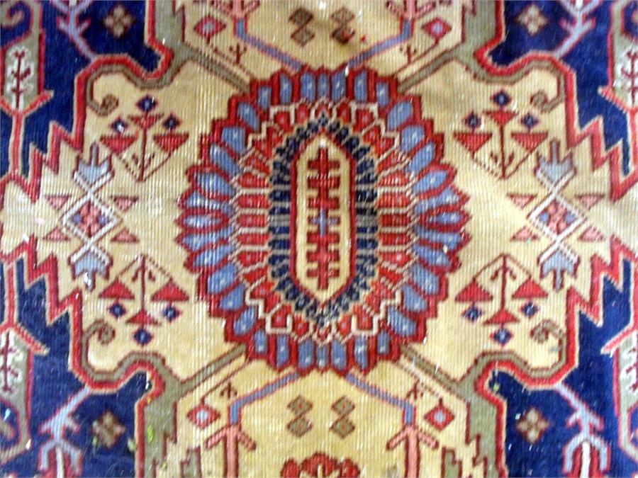 A large Persian floor carpet decorated stylised flowers on a red ground 354cm x 453cm (wear) - Image 8 of 9