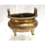 A Chinese bronze censer, decorated birds and flowers, with two character mark 13cm diameter