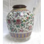 A large Chinese famille rose tea pot, decorated butterflies and flowers in enamel colours with an