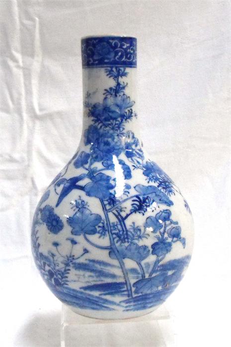 A 19thC Japanese Arita bottle vase decorated birds and flowers 26cm high