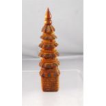 A Chinese stained ivory snuff bottle in the form of a six tier pagoda 8.5cm high